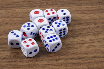 White dice on wooden background. Concept of luck, chance and leisure fun.