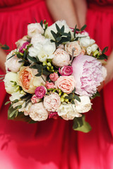 Closeup of bridesmaids holding beautiful wedding bouquet