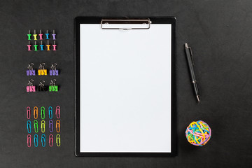 Black clipboard on a table
