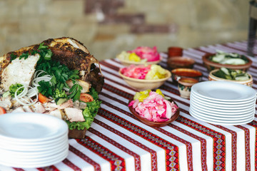 Traditional folk country wedding reception table with vodka and