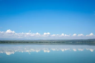 Zelfklevend Fotobehang Blue sky reflected in waters of Elmenteita Lake, Kenya © eunikas