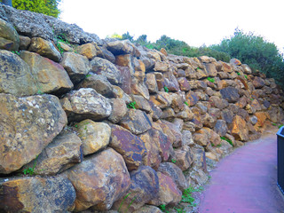 Retaining wall from rough granite blocks