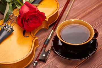 Violin, rose and coffee.