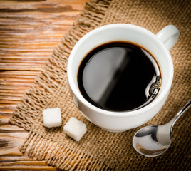 Coffee. Cup of coffee on wooden table
