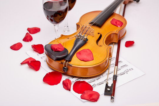 Violin, notes and red wine.