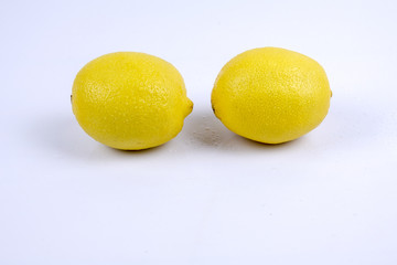 Fresh ripe lemons. Isolated on white background. Top view