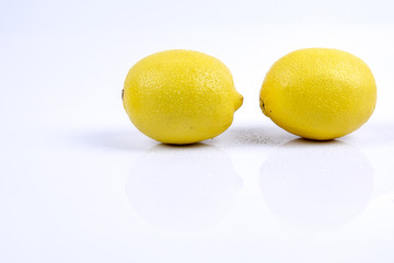 Fresh ripe lemons. Isolated on white background. Top view