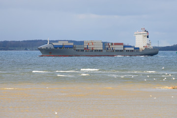 view of the barge with containers at sea