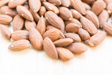 Almonds on wooden background
