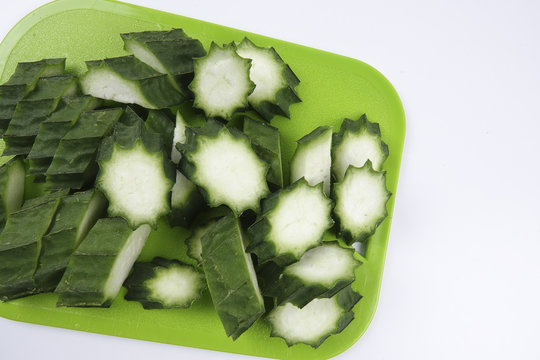 Fresh Loofah or Luffa fruit on white background