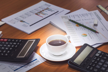 Close-up of business man holding cups of coffee