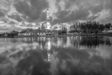 Fototapeta na wymiar Reflections of Tengku Tengah Zaharah Mosque (floating mosque), Kuala Ibai Terengganu, Malaysia