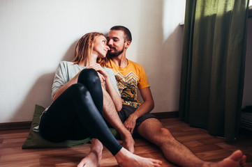 Obraz premium couple in love resting on the floo