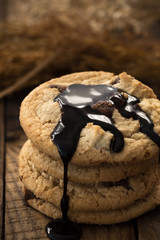 Chocolate chip cookies on old wooden table
