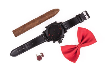 black watch with a leather strap, a cigar, and bow tie isolated on white background