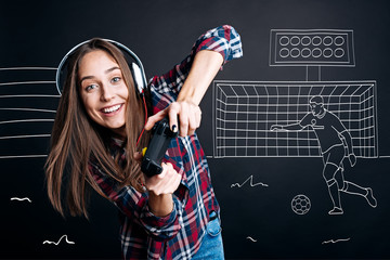 Positive delighted woman playign computer games