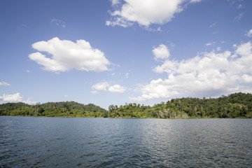 View of man-made lake of Royal Belum with nice green scenery and stumped wood.