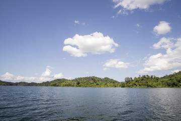 View of man-made lake of Royal Belum with nice green scenery and stumped wood.