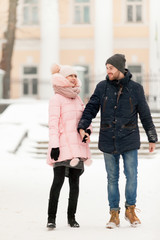 Fototapeta premium Young couple man and woman in winter Park
