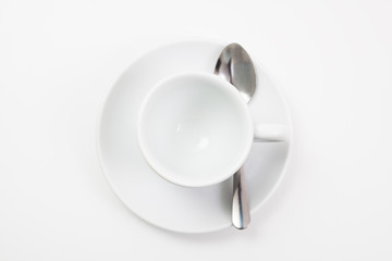 top view an empty coffee cup with spoon on white background