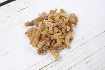 Dried shrimp isolated on wooden background
