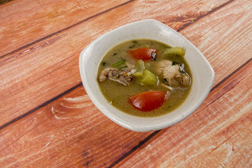 Chicken soup on wooden table. Top View.