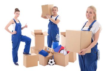 moving day concept - workers in blue workwear with cardboard box