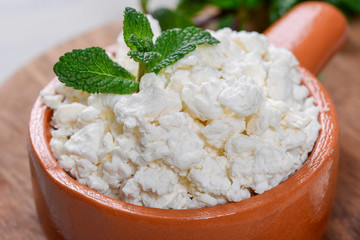 Cottage cheese in a clay pot