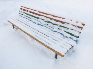 Bench covered with snow in the sanatorium