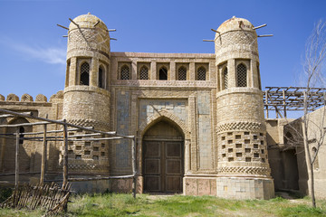 Old castle in Eastern Kazakhstan. Fortress the nomads. Walls and gate of the old fortress made of...
