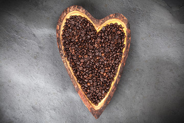 Coffee beans in a heart shaped bowl