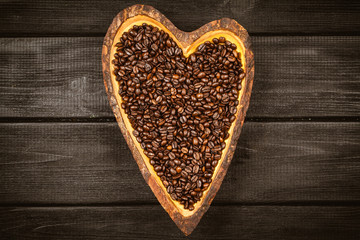 Coffee beans in a heart shaped bowl