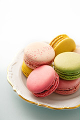 French macarons selection on a vintage plate