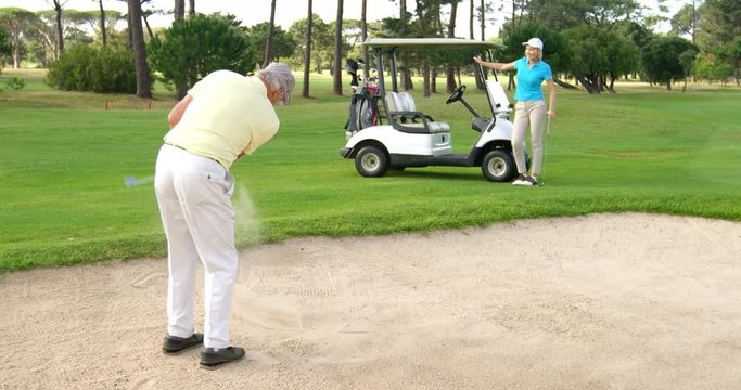 Golf players playing together at golf course 