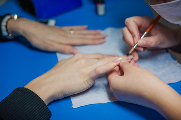 The girl paints nails