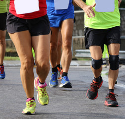 Fototapeta premium people run during sports race through the streets of the city