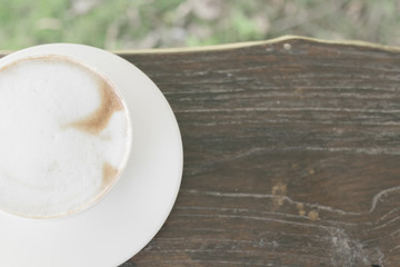 Selective focus white cup of Coffee, latte on the wooden table.