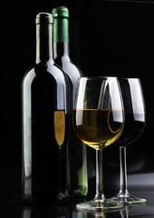 Wine glass and Bottle on black background. Red and white wine