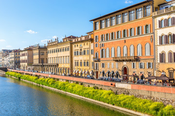 Fototapeta premium Residential buildings by the Arno River in Florence, Italy