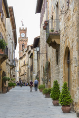 People walking in an alley in a small Italian village