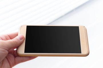 Close up of a woman using mobile smart phone outdoor