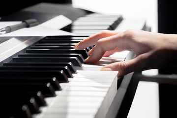 Obraz premium Playing Piano. close up