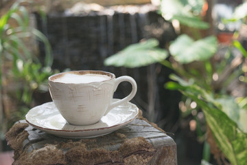 Close up white cup of Coffee, latte on the wooden table