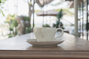 Close up white cup of Coffee, latte on the wooden table