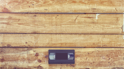 Video cassette close-up on vintage wooden background
