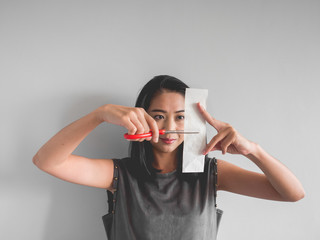 Woman wants to cut paper.