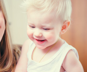 Smiling blue-eyed blond baby boy