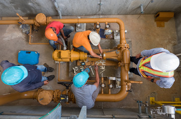 Engineer, technician and worker are alignment check of fuel oil