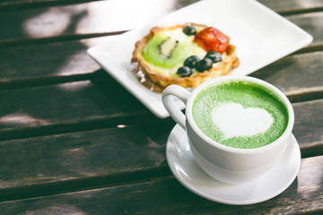 Green tea latte like heart shape with dessert