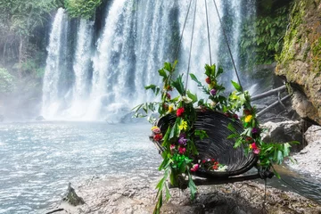 Zelfklevend Fotobehang swing with flowers to beautiful waterfall © terex